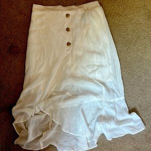 A white under knee length skirt from BCX